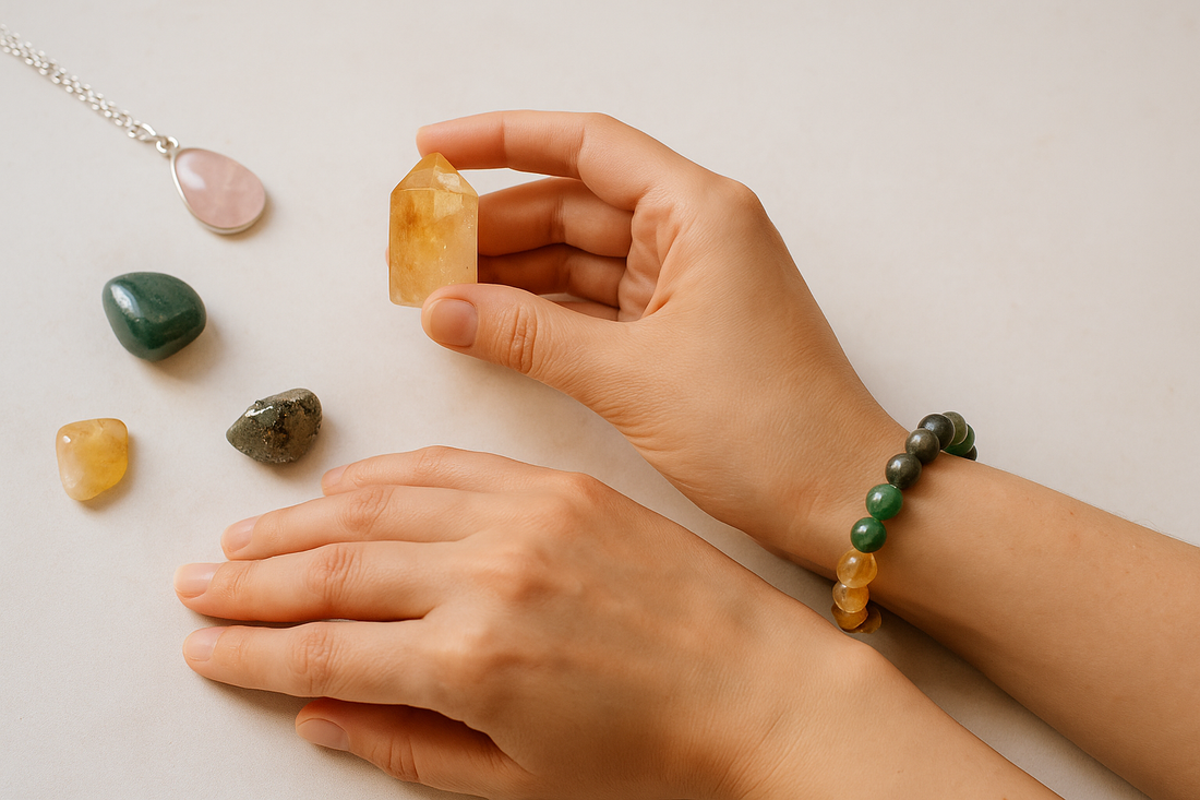 A pair of female hands interacting with healing crystals and a bracelet, symbolizing intention-setting and energy alignment. Features Citrine, Aventurine, and Rose Quartz stones.